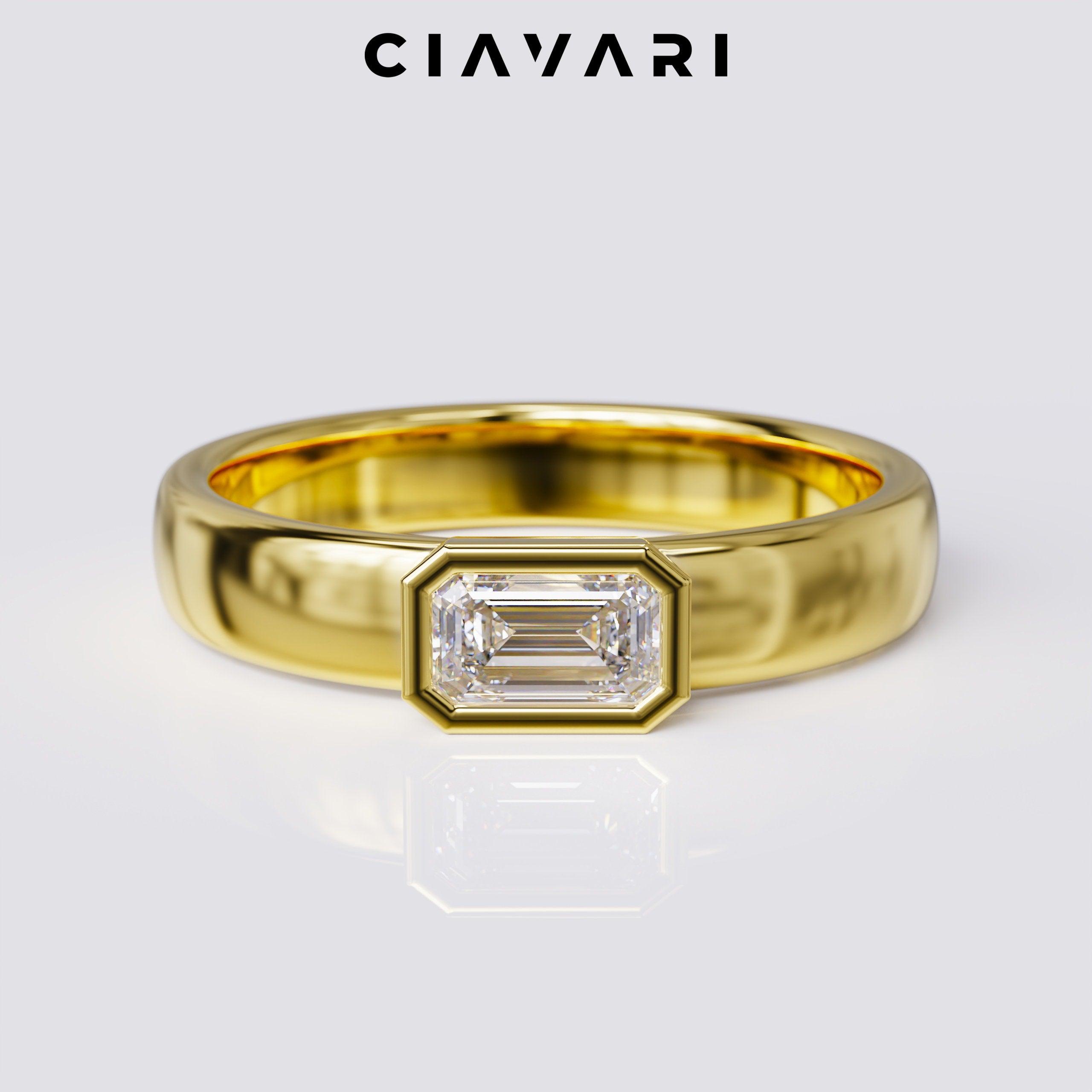 0.50 Carat Emerald Cut Ring East West Bezel Set